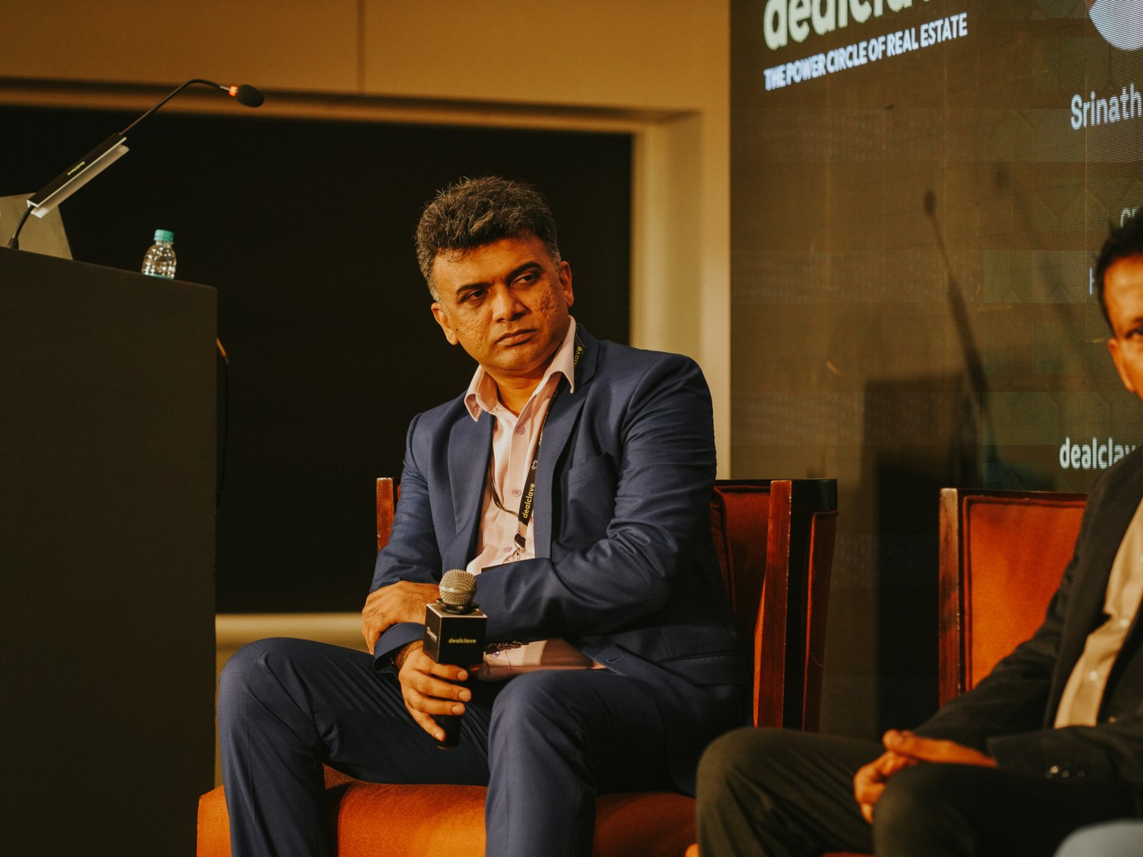 Speaker listening on the Dealclave stage